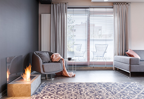 modern living room with window blinds, soft furnishings, and a cozy atmosphere