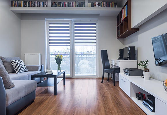 Living room featuring stylish day and night blinds with a modern decor setup.
