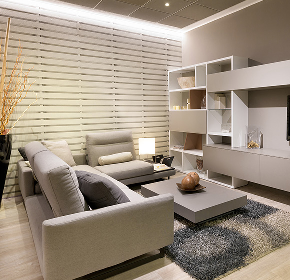 Stylish living room featuring fabric vertical blinds, modern furniture, and decorative accessories.
