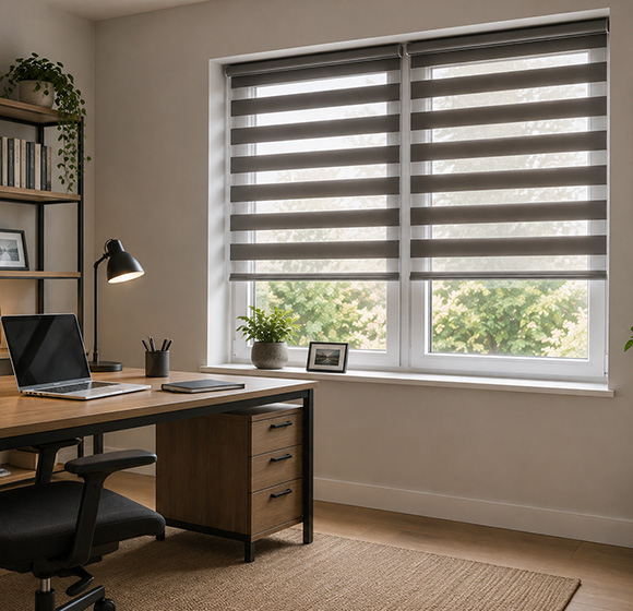 Day and night blinds in a modern home office setting with a wooden desk.